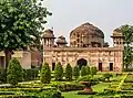 A view of the tomb with the garden in foreground