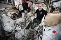 Morgan and ESA commander Luca Parmitano checking U.S. spacesuits and spacewalking tools