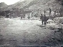 Boat attempting to navigate the river in 1897, photograph by Frank La Roche